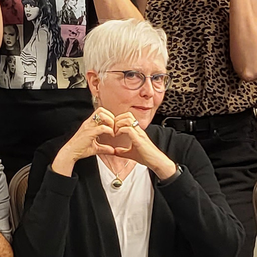 Esther making a heart with her hands